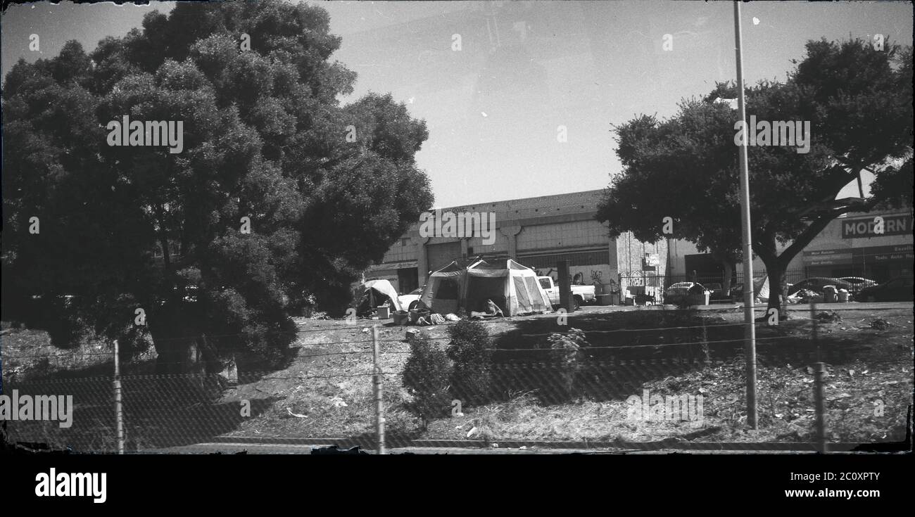 Black-and-white view of a homeless encampment in Oakland, California